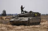 Israeli soldiers are seen near the border with the Gaza Strip, in southern Israel, on Tuesday. Photo: AP Photo/Tsafrir Abayo