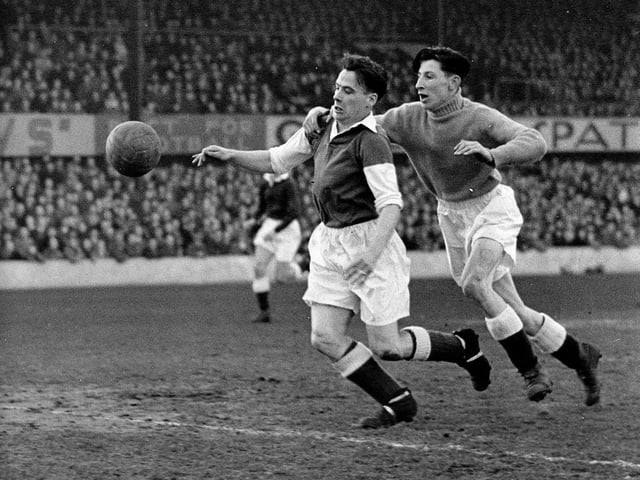 Hibs legend Lawrie Reilly scores after getting past keeper Billy Brown during a 4-2 win over Dundee in March 1950.