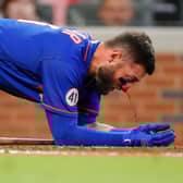 Kevin Pillar of the New York Mets takes a moment as his nose bleeds after being hit by a pitch against the Atlanta Braves. Picture: Todd Kirkland/Getty Images