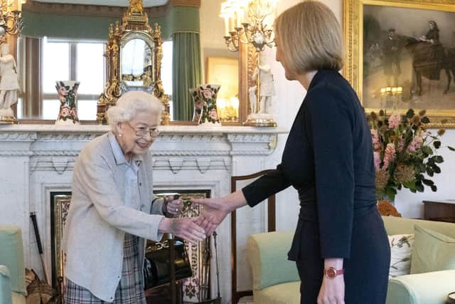 Queen Elizabeth II welcoming Liz Truss during an audience at Balmoral, Scotland, where she invited the newly elected leader of the Conservative party to become Prime Minister and form a new government.