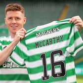 James McCarthy holds up the Celtic number he will now wear after joining his boyhood club...with 16 close to the number of year fans have spent asking him when he would make the move. (Photo by Craig Williamson / SNS Group)