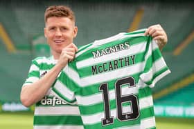 James McCarthy holds up the Celtic number he will now wear after joining his boyhood club...with 16 close to the number of year fans have spent asking him when he would make the move. (Photo by Craig Williamson / SNS Group)