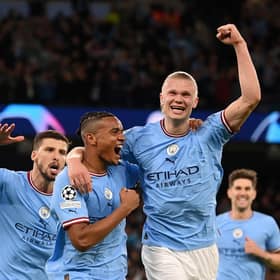 Manuel Akanji celebrates with Erling Haaland after an own goal by Eder Militao of Real Madrid (not pictured) put Manchester City 3-0 up. (Photo by Michael Regan/Getty Images)