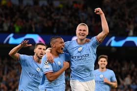 Manuel Akanji celebrates with Erling Haaland after an own goal by Eder Militao of Real Madrid (not pictured) put Manchester City 3-0 up. (Photo by Michael Regan/Getty Images)