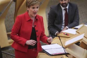 Former first minister Nicola Sturgeon alongside her successor Humza Yousaf during an update to MSPs on changes to the Covid-19 restrictions at the Scottish Parliament. Picture: PA