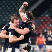 Scott Steele, centre, celebrates with Hamish Watson after Scotland's historic Six Nations win over England at Twickenham in 2021. (Photo: David Davies/PA)