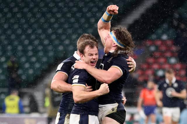 Scott Steele, centre, celebrates with Hamish Watson after Scotland's historic Six Nations win over England at Twickenham in 2021. (Photo: David Davies/PA)