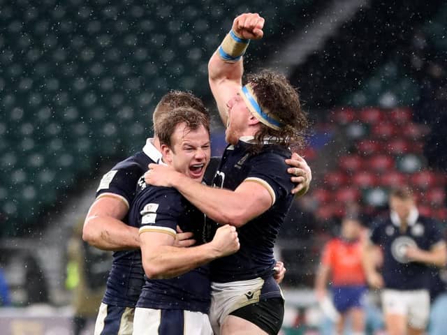 Scott Steele, centre, celebrates with Hamish Watson after Scotland's historic Six Nations win over England at Twickenham in 2021. (Photo: David Davies/PA)