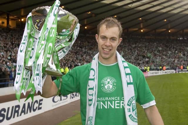 Winning the League Cup with the Hibees in 2007.