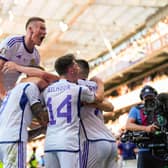 Scotland's players celebrate after Lyndon Dykes equaliser in Norway. (Photo by FREDRIK VARFJELL/NTB/AFP via Getty Images)