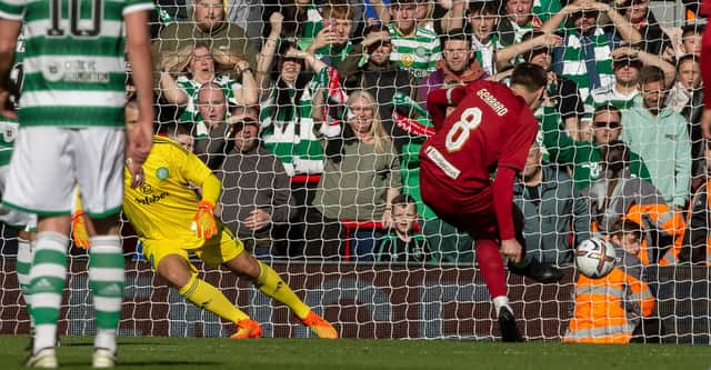 Steven Gerrard scores from the spot for Liverpool against Celtic in a charity match at Anfield.