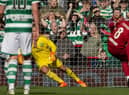 Steven Gerrard scores from the spot for Liverpool against Celtic in a charity match at Anfield.