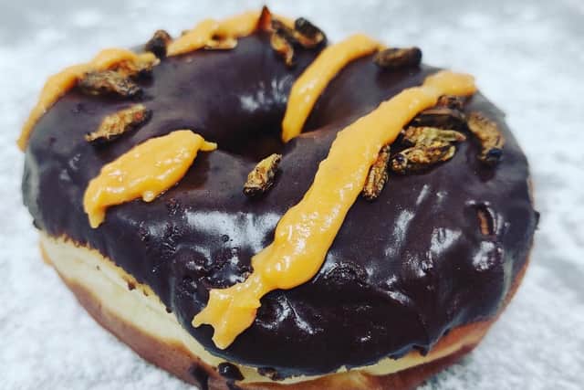The doughnut is billed as a 'great combination of chocolate and chili, with the crickets just adding a crunch'. Picture: contributed.