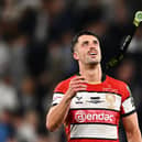 Adam Hastings of Gloucester throws up his runners-up medal after the EPCR Challenge Cup final defeat by Sharks at Tottenham Hotspur Stadium. (Photo by Dan Mullan/Getty Images)