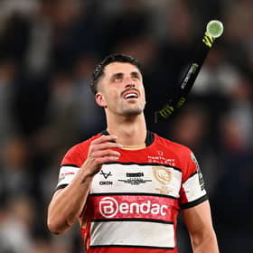 Adam Hastings of Gloucester throws up his runners-up medal after the EPCR Challenge Cup final defeat by Sharks at Tottenham Hotspur Stadium. (Photo by Dan Mullan/Getty Images)