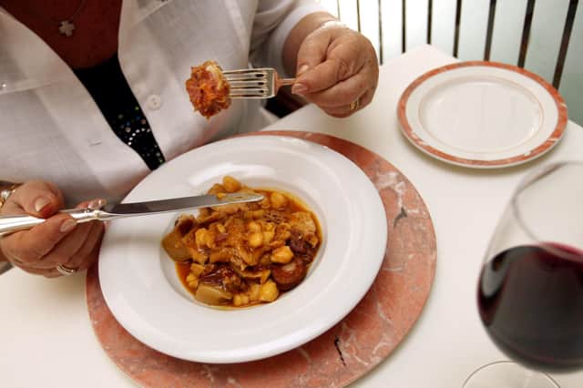 A customer eats a tripe dish at the Ca L'Isidre restaurant in Barcelona (Picture: Lluis Gene/AFP via Getty Images)