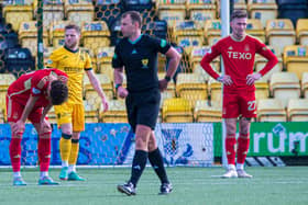 Aberdeen's Dante Polvara (left) and Angus MacDonald (right) look dejected as Bojan Miovski's goal against Livingston is ruled offside. (Photo by Sammy Turner / SNS Group)