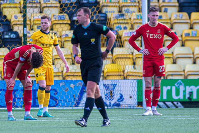Aberdeen's Dante Polvara (left) and Angus MacDonald (right) look dejected as Bojan Miovski's goal against Livingston is ruled offside. (Photo by Sammy Turner / SNS Group)