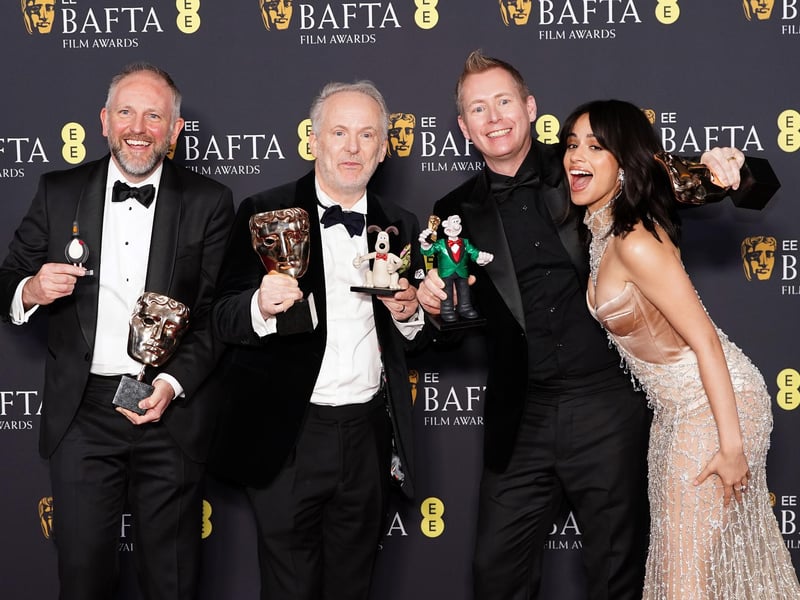 Camila Cabello presents Nick Park, Merlin Crossingham and Richard Beek with the Best Children's & Family Film award for Wallace & Gromit: Vengeance Most Fowl