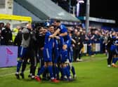 Jordan Kirkpatrick is mobbed by his team-mates after making it 1-0 to Darvel against Aberdeen.