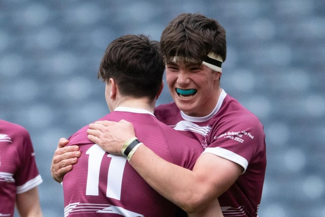George Watson's Lewis White (No 11) celebrates his try in the under-16s final