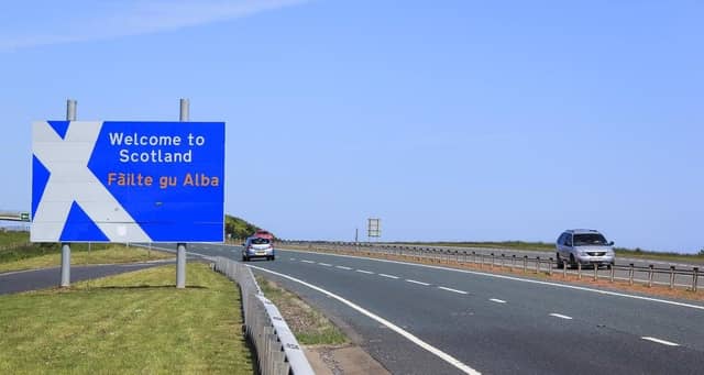 'Welcome to Scotland' sign at the border between England and Scotland.