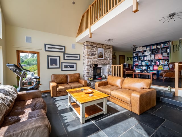 Exterior: The properties are set within 13.5 acres of land with grass and mature trees. The grounds also contain a summer house, stables and a paddock.