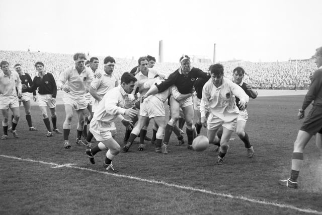 Scotland take on England at Murrayfield Stadium in the 1966 Calcutta Cup match. Scotland won the game 6-3.
