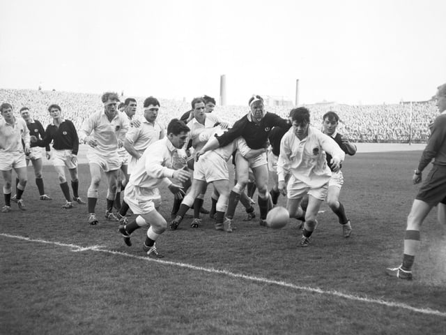 Scotland take on England at Murrayfield Stadium in the 1966 Calcutta Cup match. Scotland won the game 6-3.