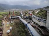 Police and emergency crews search the debris of a crushed wagon after a train accident in the Tempi Valley near Larissa, Greece. Picture: Zekas Leonidas/Eurokinissi/AFP via Getty Images