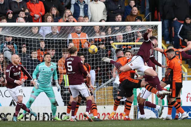 Hearts' Craig Halkett scores to make it 2-2 at Tannadice. (Photo by Alan Harvey / SNS Group)