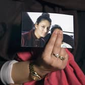 Renu, eldest sister of Shamima Begum, holds a picture of her sister while being interviewed by the media in central London. Picture: Laura Lean/POOL/AFP via Getty Images