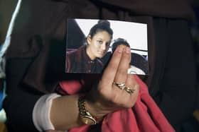 Renu, eldest sister of Shamima Begum, holds a picture of her sister while being interviewed by the media in central London. Picture: Laura Lean/POOL/AFP via Getty Images