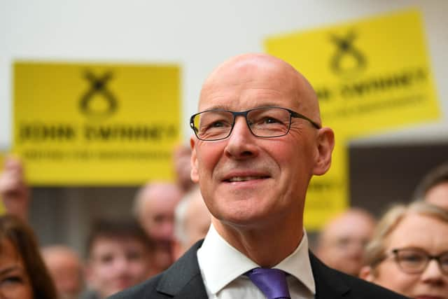 John Swinney reacts after delivering a speech to announce his intentions of running for the SNP leadership as well as his candidacy for the Scotland's First Minister position. Picture: Andy Buchanan/AFP via Getty Images