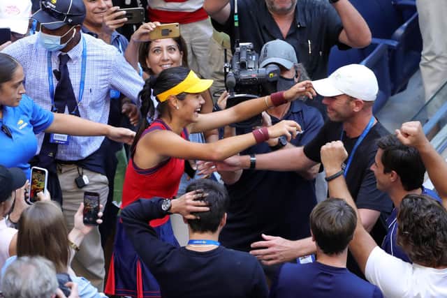 Emma Raducanu celebrates with her coach Andrew Richardson after winning the US Open. (Photo by KENA BETANCUR/AFP via Getty Images)