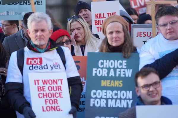 People take part in a demonstration at Old Palace Yard in Westminster, London, to oppose the Terminally Ill Adults (End of Life) Bill. PIC: Yui Mok/PA Wire