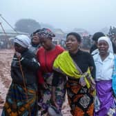 Mourners arrive for a mass funeral procession for mudslide victims at Chilobwe townships Naotcha Primary school camp in Blantyre, Malawi earlier this week.