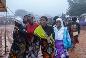 Mourners arrive for a mass funeral procession for mudslide victims at Chilobwe townships Naotcha Primary school camp in Blantyre, Malawi earlier this week.