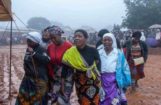 Mourners arrive for a mass funeral procession for mudslide victims at Chilobwe townships Naotcha Primary school camp in Blantyre, Malawi earlier this week.