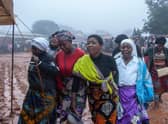Mourners arrive for a mass funeral procession for mudslide victims at Chilobwe townships Naotcha Primary school camp in Blantyre, Malawi earlier this week.