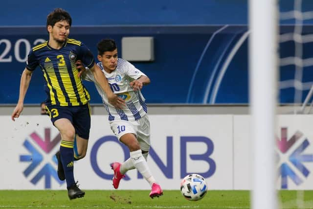 Mehdi Ghayedi (right) stands at 5'5" but topped the assist charts in Iran last season. (Photo by MUSTAFA ABUMUNES/AFP via Getty Images)