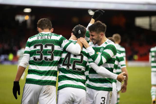 Celtic’s Callum McGregor celebrates with Greg Taylor after making it 1-0 against Aberdeen.