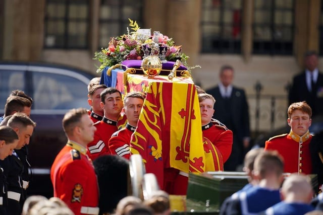 The Queen's coffin draped in the Royal Standard with the Imperial State Crown