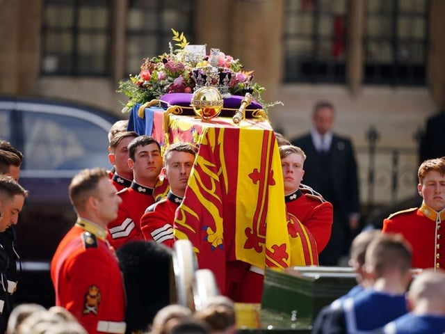 The Queen's coffin draped in the Royal Standard with the Imperial State Crown