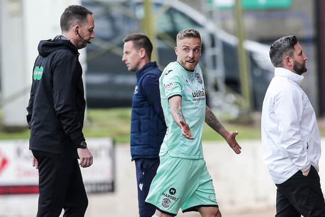 Hibs midfielder James Jeggo walks off the pitch after being shown a red card in the 1-1 draw at St Johnstone. (Photo by Ewan Bootman / SNS Group)