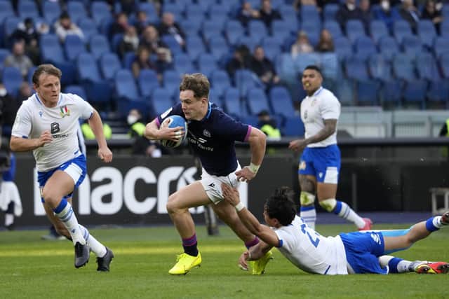 Darcy Graham en route to scoring Scotland's fourth try in the 33-22 win over Italy. (AP Photo/Gregorio Borgia)
