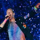 Chris Martin from Coldplay. The British rock band are set to headline Glastonbury Festival on Saturday night, but will the weather hold out for fans attending the festival? (Credit: Getty Images)