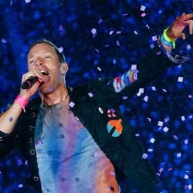 Chris Martin from Coldplay. The British rock band are set to headline Glastonbury Festival on Saturday night, but will the weather hold out for fans attending the festival? (Credit: Getty Images)
