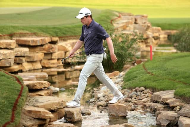 Bob MacIntyre crosses the creek to the 18th hole during the third round of the DP World Tour Championship at Jumeirah Golf Estates in Dubai. Picture: Warren Little/Getty Images.