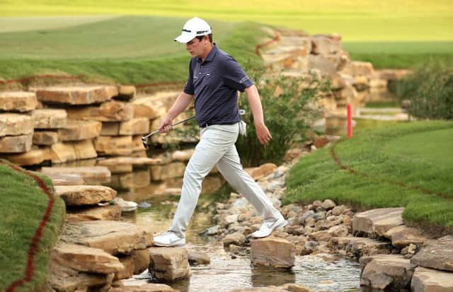 Bob MacIntyre crosses the creek to the 18th hole during the third round of the DP World Tour Championship at Jumeirah Golf Estates in Dubai. Picture: Warren Little/Getty Images.